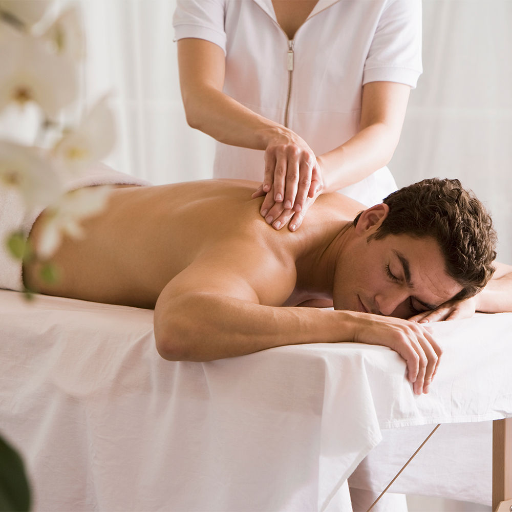 Male guest receiving a professional body massage